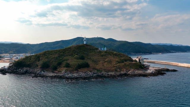 Lighthouse on a small island by the sea