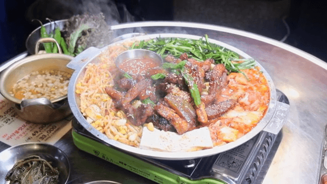 Korean barbecue sizzling with vegetables
