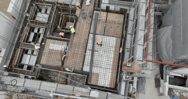 Construction site with workers and scaffolding