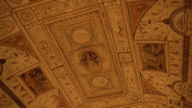Intricately painted ceiling in a historic room