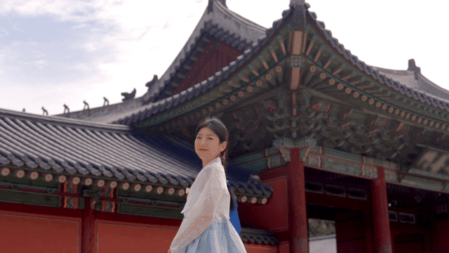 Woman in hanbok at a traditional palace