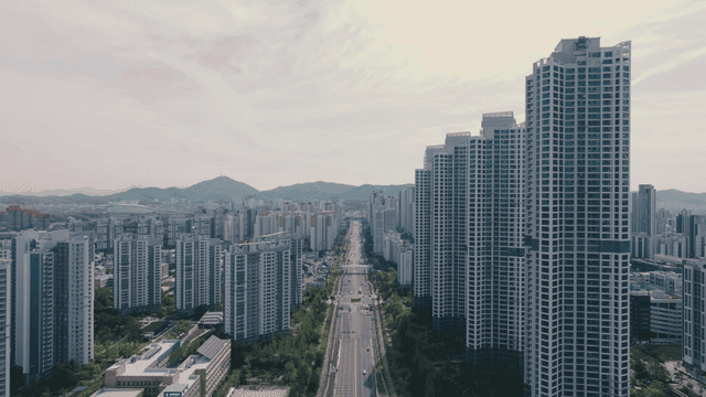 Cityscape with high-rise buildings and central road