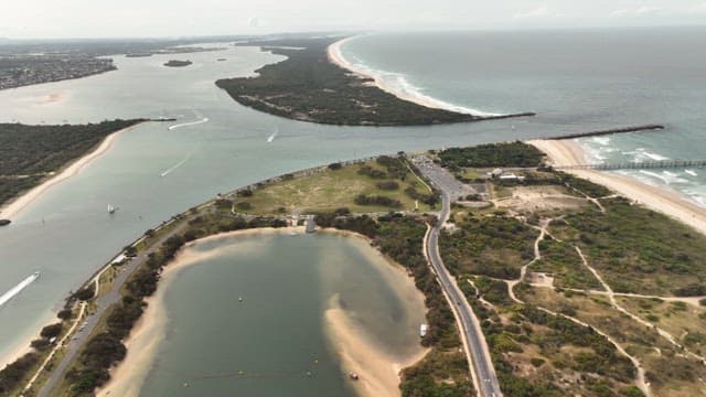 Aerial View of Coastal Cityscape and Beach