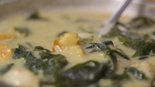 Spoonful of warm glutinous rice dumplings with dried pollack and seaweed