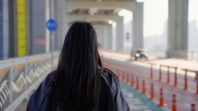 Woman jogging on a jamsu bridge