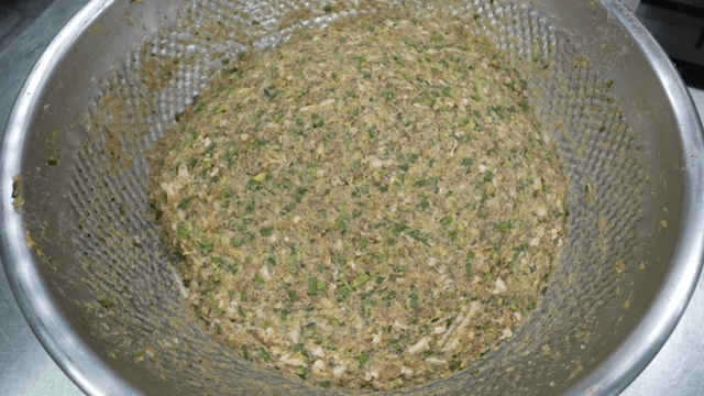 A bowl of mixed ingredients for dumplings