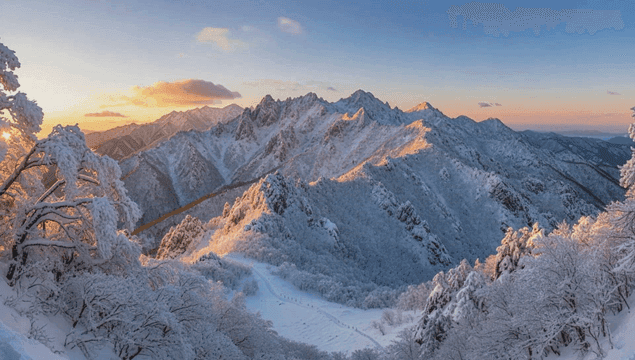 Snow-covered mountains at dawn
