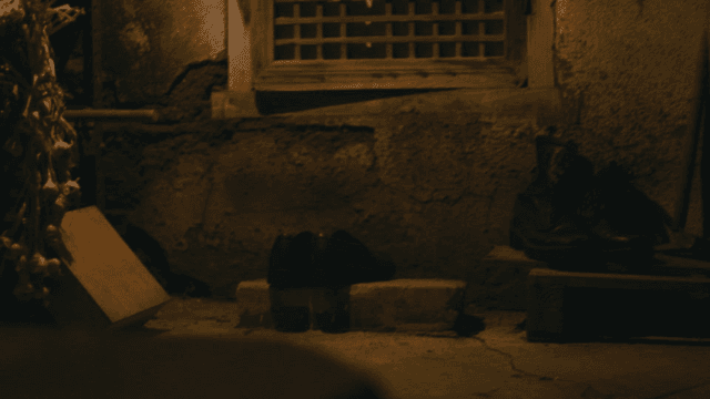 Dimly lit room with shoes and garlic