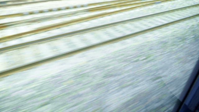 Railway and platform view from a running train