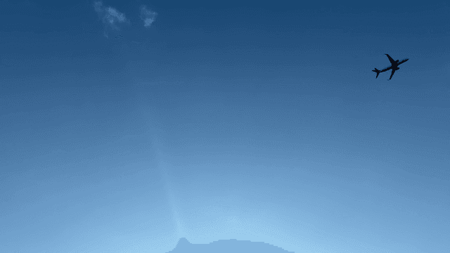 Airplane flying in the clear blue sky