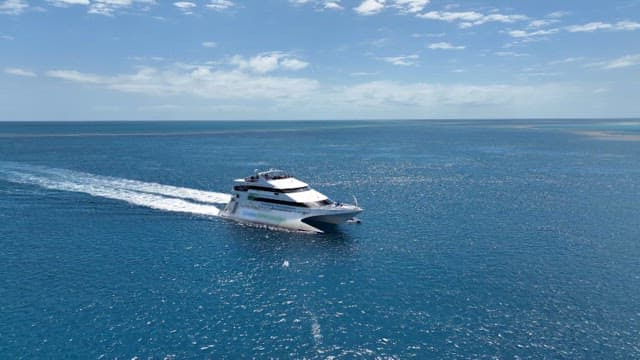 Speedboat Cruising in Vast Blue Ocean