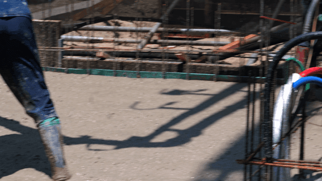 Workers pouring concrete at a construction site