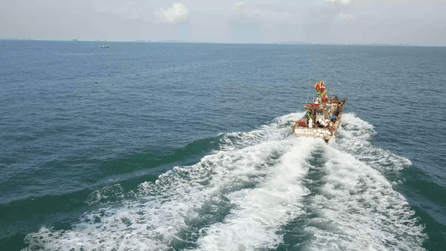 Ship sailing blue sea