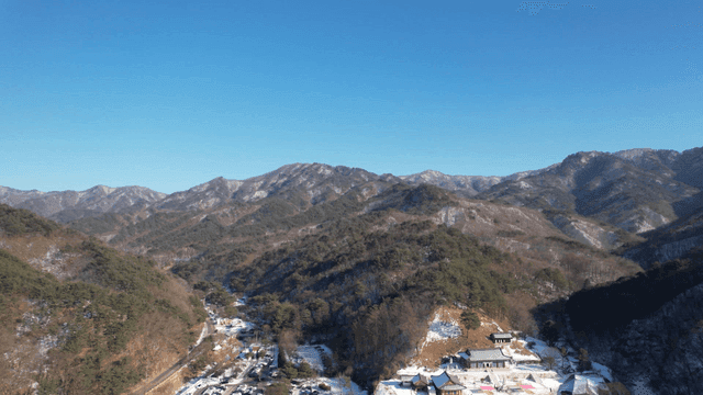 Snowy mountains and a temple in winter