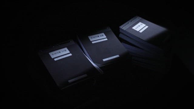 Stacks of Documents of Police in a Dark Room