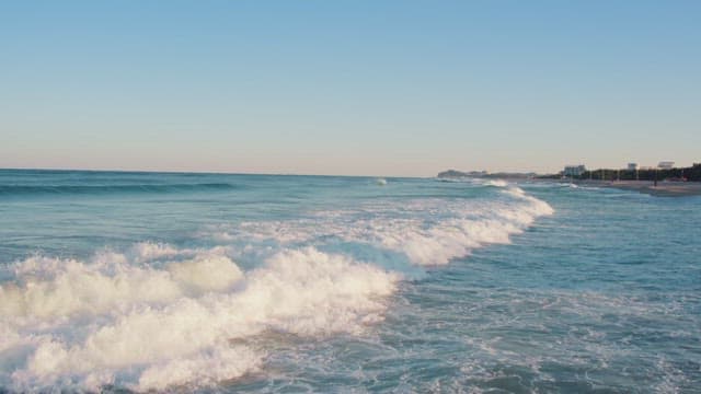 Waves gently crashing on a serene beach