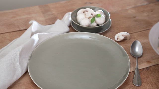 Neat wooden table with delicious mushroom fried rice on it