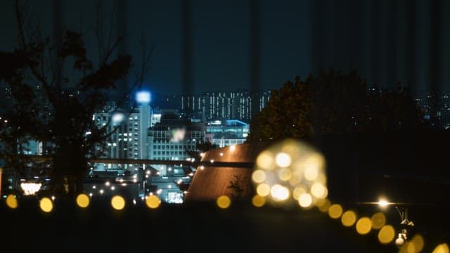 Decorated terrace with colorful city night view in the background