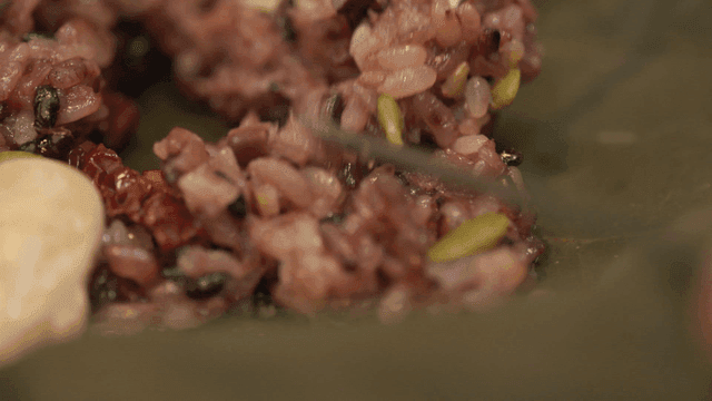 Chopsticks for tearing lotus leaf rice containing grains and nuts