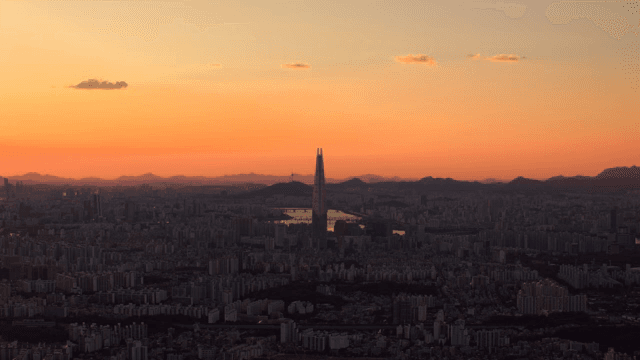 City view with tall towers at sunset