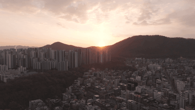 Sunset over a city with high-rise buildings