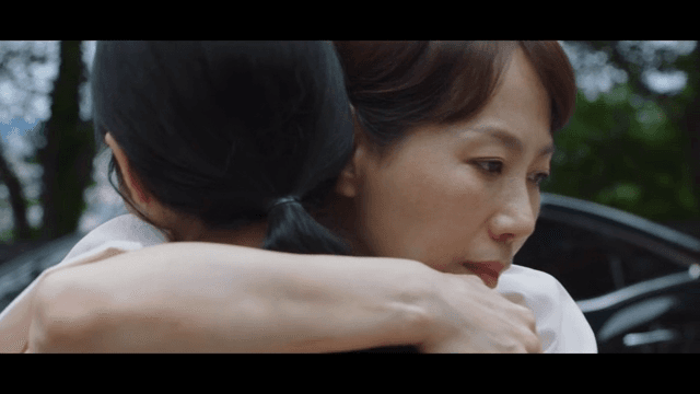 Heartfelt hug between two women