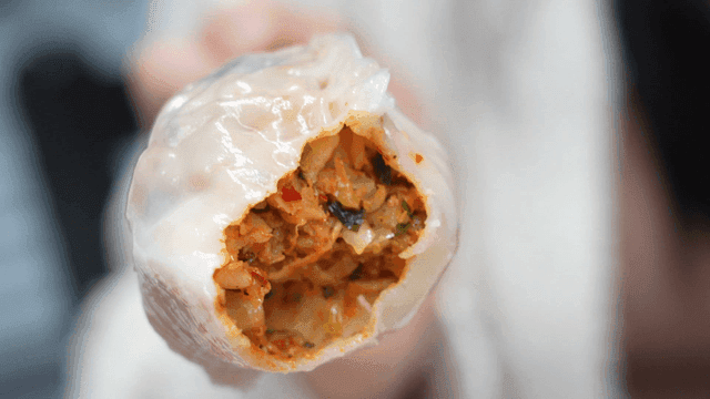 Bite taken out of kimchi dumpling