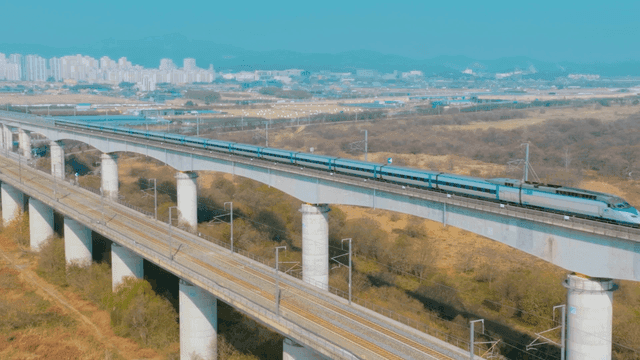 High-speed train crossing a bridge