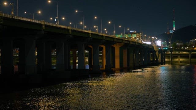 City Bridge with Street Lamp and Waterscape at Night