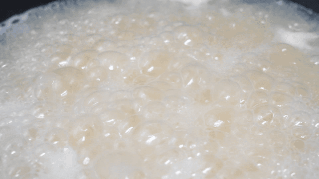 Broth in frothy pot