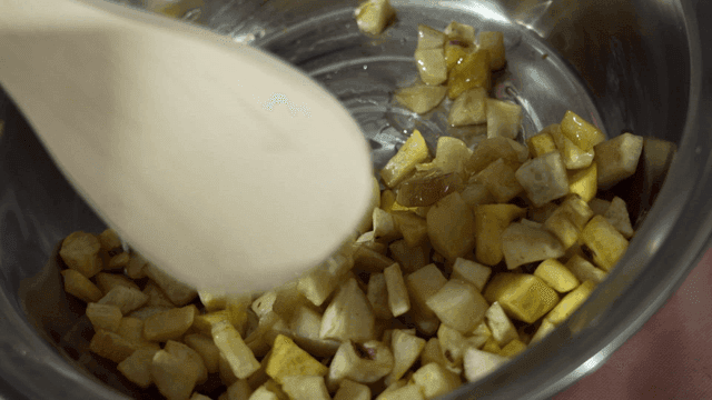 Sweet potato fries with syrup dripping from bowl