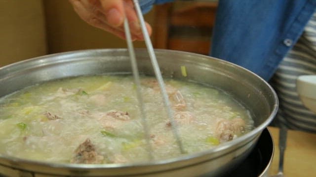 Boiling chicken soup in a pot