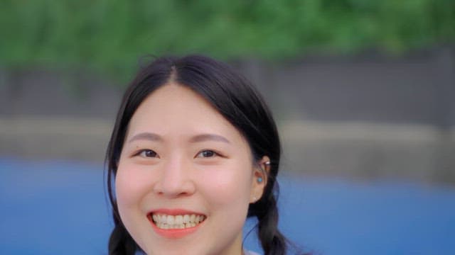 Young woman smiling outdoors