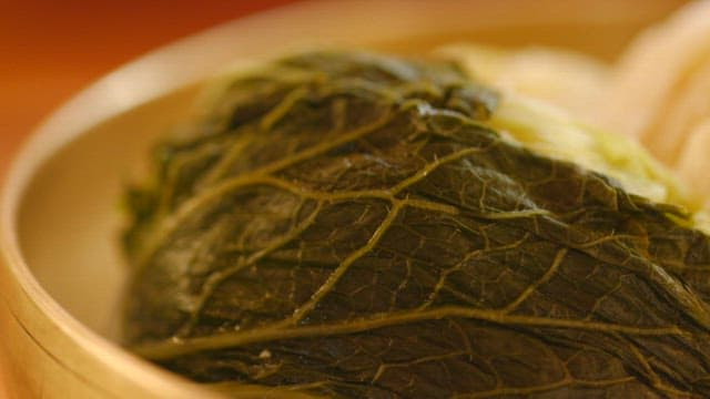 Fresh and crunchy white kimchi neatly arranged in a bowl