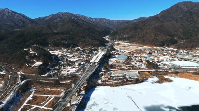 Aerial View of Railway Through Mountainous Town