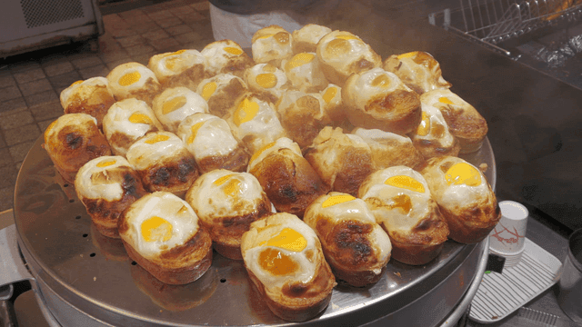 Steaming egg bread on tray