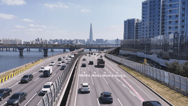 Bustling city highway by river