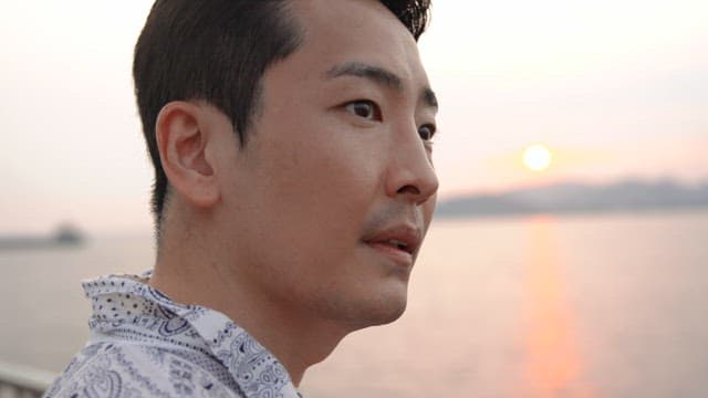 Man enjoying a sunset by the sea