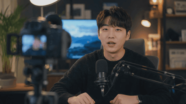 Man filming video in home studio