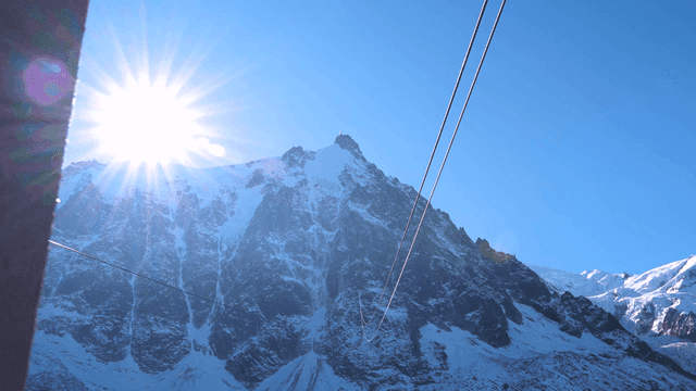 Cable car ride with snowy mountain view