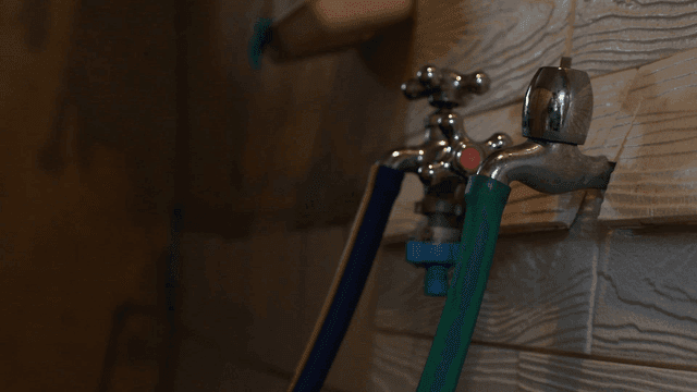 Rubber faucet with hose attached