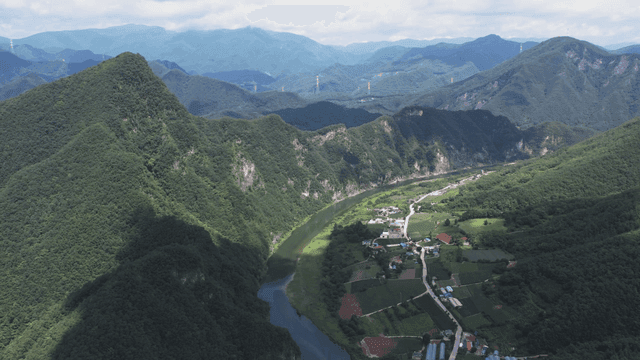 Aerial view of lush mountains and a river