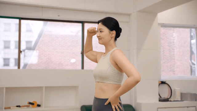 Woman stretching in a fitness studio