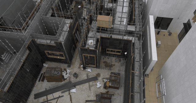 Construction site with scaffolding and workers