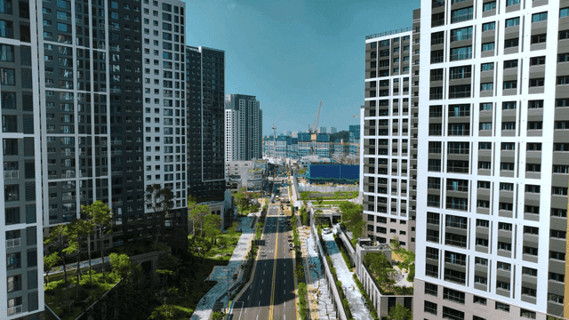 Bustling city street with tall buildings