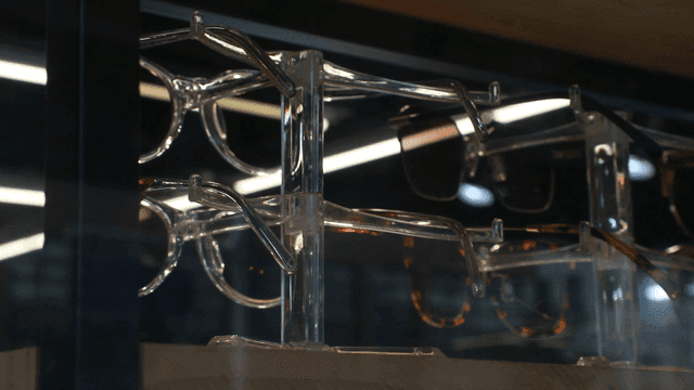 Display of various eyeglasses on a rack