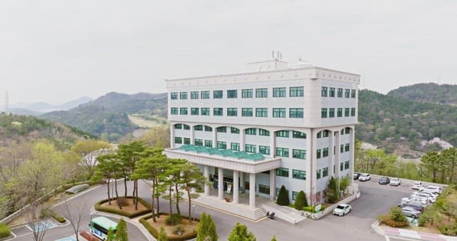 Large building surrounded by trees