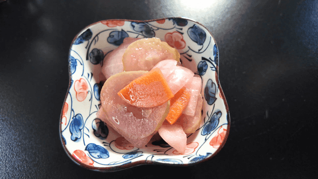Bowl holding colorful pickles