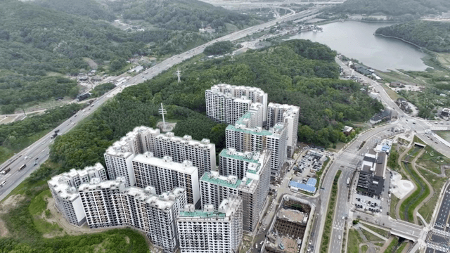 Aerial view of a city with surrounding greenery