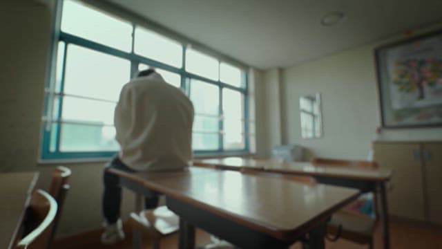 Student Alone in Classroom